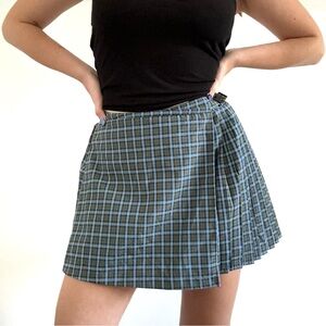 Blue and green plaid mini pleated tennis skirt with zipper and clasp closure